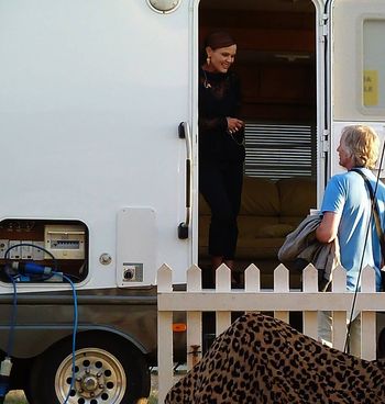 Visiting with my acquaintance Belinda Carlisle at the Rewind Festival in England. I love the random pile of leopard print material outside her trailer.
