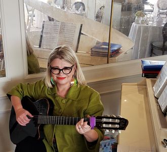 Guitarist performing in restaurant at St Brelades Bay Hotel Jersey