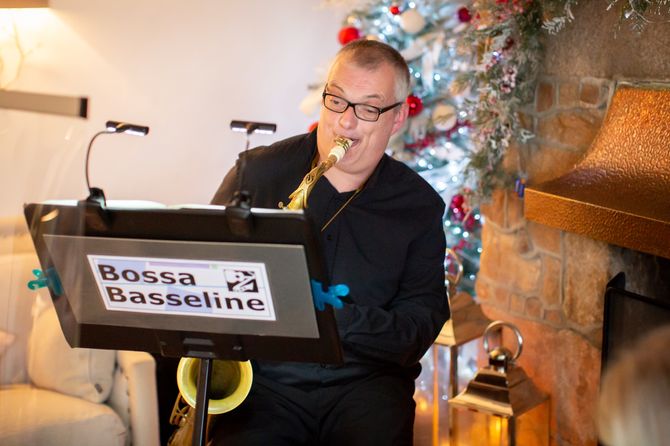 The Bossa Basseline Duo: Jules on tenor saxophone, at a winter Wedding Drinks Reception. Photograph courtesy of Paul Wright Photographer.