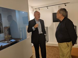 Jeffrey Ohrenstein explaining the history of the Czech survivor scrolls to Martin Levson