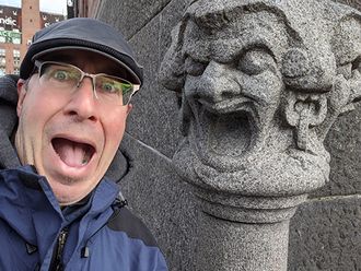 Mark Binder and a gargoyle
