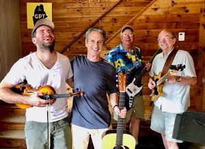 Logan, me, Capn Frank and Gary play a set after slurping bloodies and tasty oysters at Glidden Oyster Farm in Newcastle, ME.