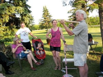 In June Julane demonstrated her pocket fiddle at the Lund family farm near Rolette, North Dakota and her uncle, Ken Lund, tried playing it. Doesn't he look a bit like Ole Bull or maybe Grieg?