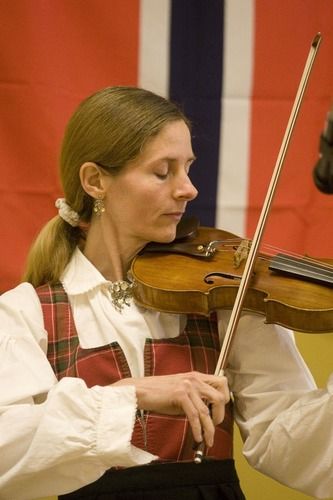 Julane performed Norwegian music on violin and Hardanger fiddle at the Madden Art Center in Decatur, Illinois on June 7, 2013. The performance was held during the opening of a special Norwegian exhibit at the center.