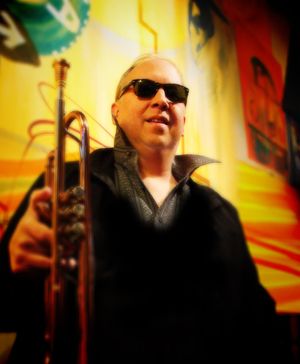 Jackson, has been with Kalimba now for over 2 years, and his trumpet playing and professional experience are a true asset to this group. He is appropriately name "Cat Daddy" because of his amazing playing and his exceptional dress.
For Jackson Rice success came early as he has played amazing venues such as Carnegie Hall and Royal Albert hall as well as a full European tour at the age of 19. A child prodigy and a classically trained musician at first then later into jazz where he found his passion for composition.
Working for nearly 20 years behind the scenes he has recorded, mastered, produced or performed on over 2000 recordings. Now a major artist in his own right, performing worldwide, selling his solo CD releases, he has found a form of creative expression that begins in traditional jazz and expands beyond the limits of any single genre. With "The Firefly", his first CD release, he established himself as one of the important, innovative trumpet players of the contemporary music world. And now with "'59 It Speaks For Itself" he has shown he can create a beautiful listening experience that takes you all the way back to 1959, the year he was born.
