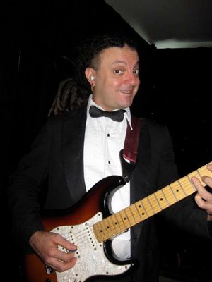 "The incomparable" Bobby Koelble is a guitar wizard! He's been a Buzzcat since 1999. When not performing in a tuxedo with The Buzzcatz, you can see him rocking out in sold out arenas all over the world with the legendary Heavy Metal band DEATH, a gig he's had since the mid-90's. A graduate of Berklee College Of Music in Boston, Bobby is a professor of music at Rollins College and UCF. Check out his original bands Junkie Rush and The Absinthe Trio, playing around Orlando regularly. If you are a fan of the guitar, you will really enjoy Bobby!
