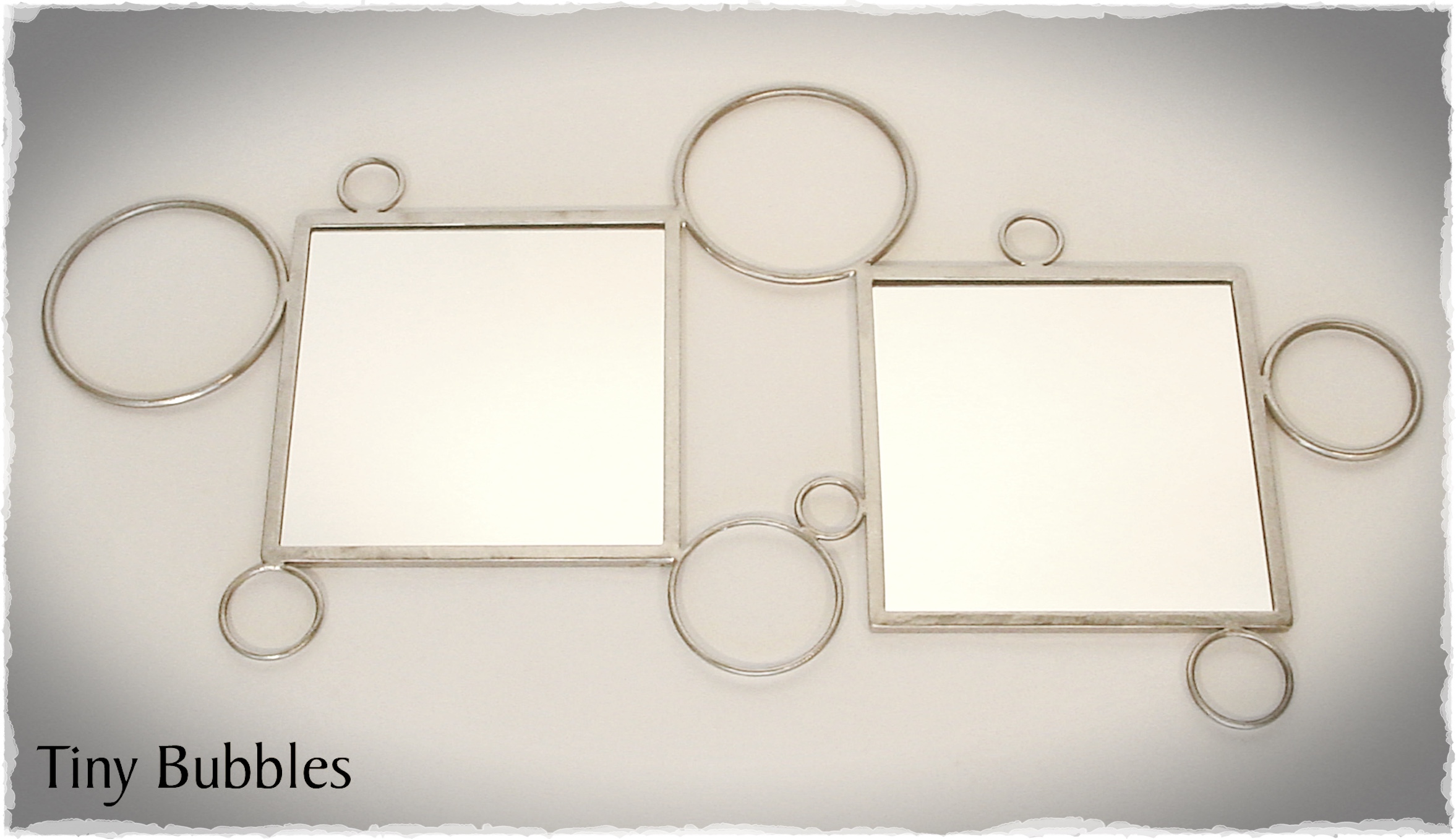 "TINY BUBBLES"
Custom mirror. 3' wide. 1999.