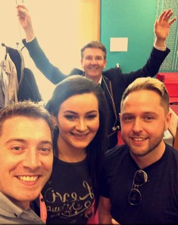 There's always one! Olivia with Barry Kirwan, Derek Ryan, and a certain Mr. O' Donnell in the background!