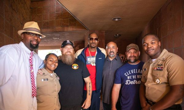 B.Taylor, active duty personnel, and veterans experiencing a entire day with Snoop Dogg.