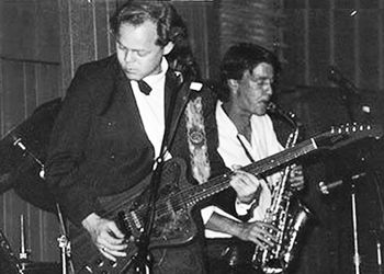 Playing Clarence "Gatemouth" Brown's famous Gibson Firebird with custom leather pickguard. King Eddy, Calgary 1986. Gibb Monks on sax