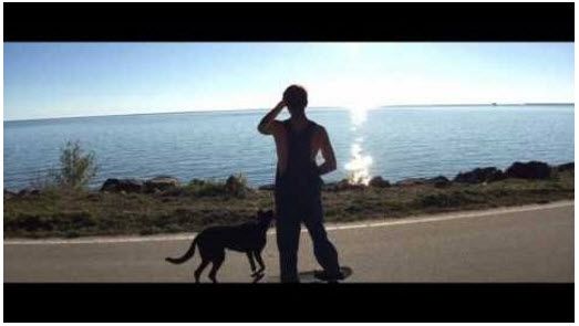 Screen capture of Devin Jay Baker and Raven (Dog) from Smash Mob music video Take Me For Your Ride