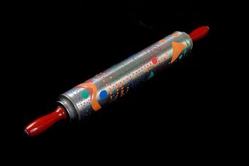 “Metal Rolling Pin Shaker/Chimes,” corn, oil paint, embedded bicycle spokes, metal disc, wood handles and epoxy glue.