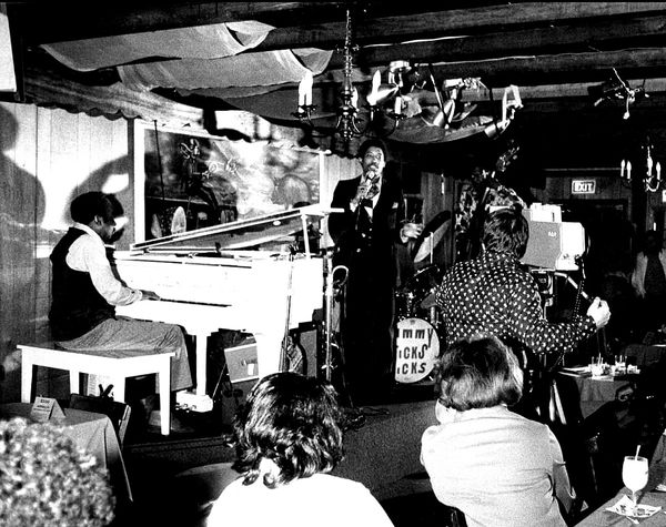 In 1975 John Malachi surprisingly Introduces him as Your Majesty George V. Johnson Jr," Opening Night during his debut and first professional concert at the Jazz Club "Pigfoot," owned by guitarist Bill Harris and wife Fanny located on Rhode Island Ave, Washington DC.
Note: John Malachi gave Sarah the stage name "Sassy" Sarah Vaughn
Filmed by The Carol Hall TV Show (Channel 7)
Photo by Carlos