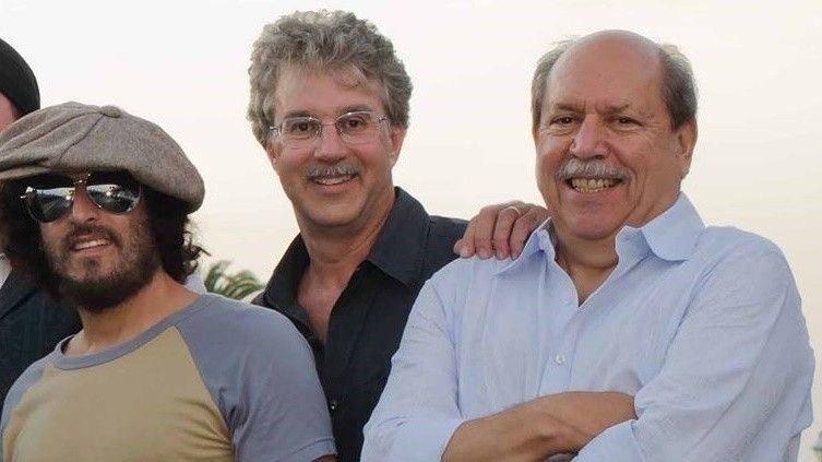 Shorenstein (middle), Barry Rosenbaum (right) and faux-Springsteen Josh Schrieber pose for a publicity photo for their former band, Thunder Road.