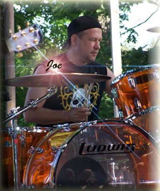 Joe Ward ~ It all started for Joe when The Beatles appeared on The Ed Sullivan Show. Inspired by Ringo and then influenced by the likes of John Bonham, Ian Paice, Carl Palmer, Cozy Powell, and Buddy Rich, Joe provides energy and a solid back beat for goROCKyourself. He has been performing since the age of sixteen and during any given show, you will see him display his talent and enjoyment for playing rock, blues, funk, r&b, and metal. For Joe, it's all about the performance and audience involvement. Some of Joe's past bands include Mad Hatter, Barracuda, Innocent Victim, Vertigo, Mirage & Take Cover, covering the NJ and NY club circuits. He has performed at many venues including the Count Basie Theater and has opened for such acts as The Edgar Winter Group, Steppenwolf, and The Joe Perry Project. Joe uses Ludwig drums and hardware, Paiste cymbals, Remo drumheads, and Pro*mark sticks exclusively.