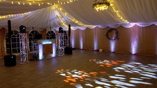 DJ Ricky Gold DJing a Wedding at Longthorns Farm, Wareham. Pure Elegance with large 1.5m Podiums and extensive uplighting.
