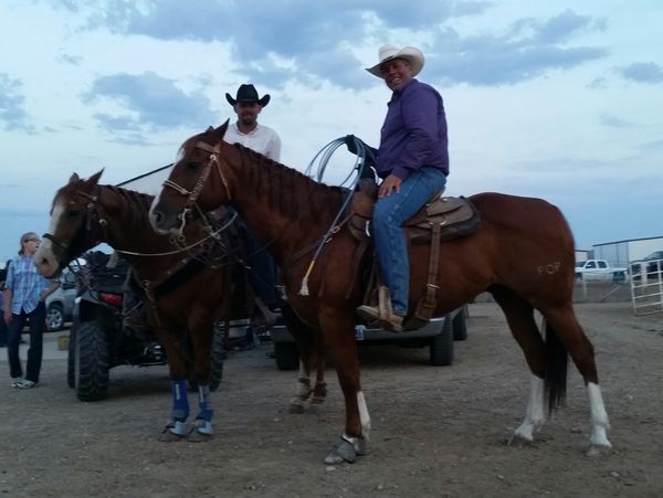 Steve Hampton Jr borrowing John Wayne for the Lander 4th of July rodeo, and Emile on his heel horse Velvet.