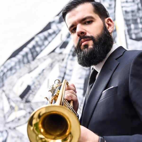 Josh Lawrence- Trumpet
Trumpeter Josh Lawrence is the founder of Color Theory, a jazz ensemble for which he composes works fusing swing, the blues, Afro-Cuban music, and hip-hop. Lawrence uses sound to paint expressionist portraits and landscapes inspired by art, architecture, philosophy, and social observation. Color Theory’s 2017 debut Posi-Tone Records release led to a Chamber Music America New Jazz Works award for his Lost Works Suite (premiering 2018) inspired by painter and art theorist Vasily Kandinsky's first three compositions which were destroyed during World War II.
Now living in New York, Lawrence studied at the University of the Artsin his hometown Philadelphia. There he co-founded the Fresh Cut Orchestra, an experimental electro-jazz ensemble that won a Pew Center Philadelphia Music Project grant, an American Composers Forum Subito grant, a Kimmel Center Jazz Residency, and released two albums with Ropeadope Records.
Lawrence is also the co-founder of oljo creative minds, a NY-based multimedia production company started in partnership with designer/photographer Ola Baldych. Other work includes collaborations with pianist Orrin Evans' Captain Black Big Band and Tarbaby as well as recordings with saxophonist Caleb Curtis, bassist Jonathan Michel, vocalist Laurin Talese, guitarist Matt Davis' Aerial Photograph, R&B legends Boyz II Men, and the great Erykah Badu.