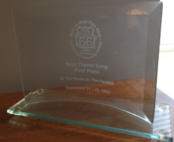 Route 66 "Best Theme Song Award" at the Route 66 International Theme Song Contest for the song, "The Last Riders On Rt. 66". Music & lyrics by Chet Nichols. Copyright by Chet Nichols 2002 (ASCAP).