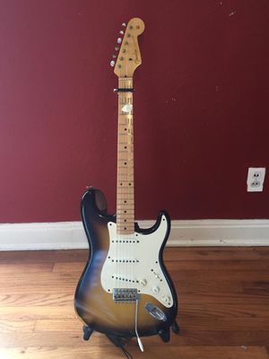 This is my 1956 reissue Fender Stratocaster Custom Shop Time Machine Relic (whew!). Unlike the days when we tried to take care of our instruments, this guitar looks like it was dragged behind a bus brand new. I don't get it, but it has that old feel and plays and sounds great. I used it on "The Torch", "Fortune Morning" lead, "She's in the Garden" rhythm, "Try Me", "Love of a Thousand Days" and "Take a Little Time." Also on the treble lead on "Ball and Chain."