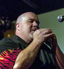 DARRIN HARVEY - Vocals/Harmonica
Darrin Harvey is a veteran broadcaster with over twenty years experience in both radio and TV. His radio career has been largely in the Annapolis Valley with the exception of his role as a producer/researcher on the syndicated blues show, The Blues Own.
Darrin's first love is music and specifically live music. He frequents live music shows and festivals of all genres in and around Nova Scotia and across the country.
East Coast Music Unplugged is Darrin's second series with Eastlink and his third role as TV host including his duties on The Fight Network series, Wrestling Reality.
In his spare time Darrin studies guitar at The Bernie Zinck Music Studio, is the lead singer & harmonica player for The No Name Blues Band and makes up nicknames for the members of (and performs with) Bluesmobile.