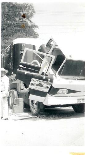 Ralph, supervising the repair of of a semi truck. All of his equipment was painted 'McCutcheon' red, a dark maroon.
