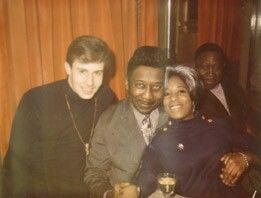 A YOUNG PAUL OSCHER, MUDDY AND FRIEND, IN BACKGROUND MUDDYS VALET AND DRIVER BO (ANDREW BOLDEN). CHICAGO CLUB 1960’S