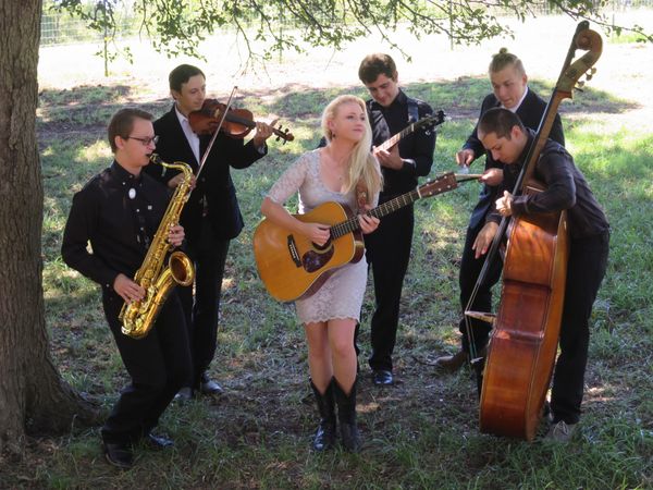 Mikki Daniel and Texas Wildfire jamming at a private event. Eric Vazquez, sax; Jordan Brambila, fiddle; Mikki, rhythm guitar; Glenn McLaughlin, lead guitar; Mitch Albers, drums; Nathan Phelps, bass. Western Swing at its best!