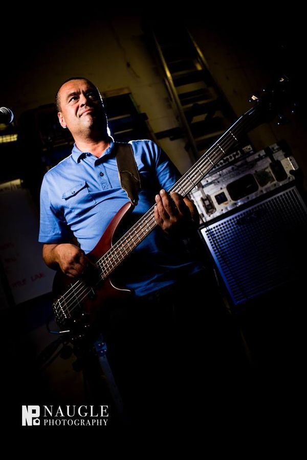 Jonam LeBlanc was born in Petaluma, Ca, but grew up in San Diego. His family encouraged piano lessons; which he began at age 7. At 12 years-old he picked up a guitar. Traditionally trained as a jazz musician Jonam has a deep appreciation of blues, ragtime, swing, and big band sound.
"I was always captivated by the simple complexity of world roots music," says Jonam of why he loves reggae. Reggae was the main music of his high school years, and influenced him to pick up a bass guitar. Since the age of sixteen Jonam has played bass, and transitioned to a five-string.
Over the past decade he has played in bands such as Sticky Situations with Ikaika Beamer Music, and Shoreline Rootz. Jonam is a family man feeling blessed to be raising his kids in Southern California. He enjoys taking advantage of the beach, golf courses, and the mountains. He still finds time to keep making music, and make music a part of life.