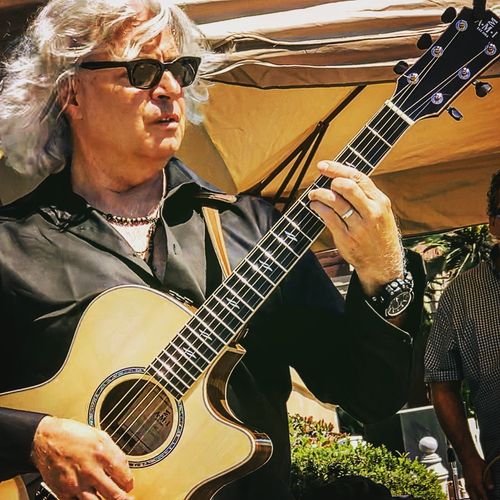 Detweiler playing his AMI Guitar (Modern Series GZCE-3 model).