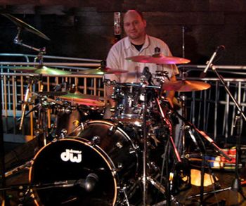 Kevin Arnett - Drums Kevin began beating on pots and pans at the age of 2 before moving onto cardboard boxes and then the drum set in 7th grade. Kevin was drum captain and lead snare of his high school marching band and primary drummer for the jazz band which represented the USA with a international tour through Switzerland. Throughout the years Kevin studied with drumming great Evan Stone and inspired by the drumming of Teddy Campbell, Carter Beuford, Gary Chaffee, Dennis Chambers, Stewart Coplan, jo jo Mayer, and many others. You may have seen Kevin perform with such groups as Marmalade, The Blue Note, Uncle Funky, Red Rock Garden, The Limericks, and many other performing groups over the years. He also works as a freelance musician on various musical projects. Email:Kevin@DeLoreansBand.com