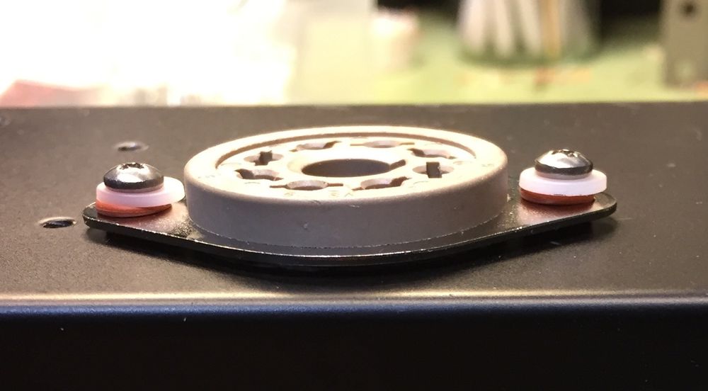 This is the 6SL7 tube socket in our new Delta V6 Octal 15-watt harp amp. Take a closer look... Tiny rubber washers above and below the mounting flange isolate the socket from the amp chassis. Why does Bruce Collins go to such detail? It's because while the 6SL7 tube is revered for great blues tone, it can also be prone to microphonics. Vibrations from the amp chassis can cause it to be a bit noisy. We want your amp to have color and texture in its tone, not mud