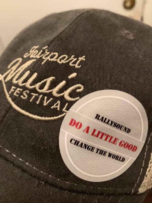 RallySound's "Do A Little Good" sticker on display to represent the good Fairport Music Festival does with their annual event