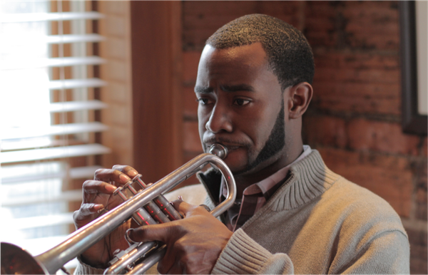 Eliezer Emmanuel "Eli" Brooks was born in Detroit, MI. He was first introduced to the trumpet by Howard House at the age of eight at Birney Elementary. He was then later taught jazz by Nathaniel’s brother, Ryan Felton. During a high school visit by trumpet virtuoso Wynton Marsalis, Eli received his first trumpet from Wynton. His life then was even more devoted to music. He is currently a senior at the University of Michigan in Trumpet Performance. Although he gave up a social life to obtain musical perfection, Eli has been able to finally find love in Alexandra Hylton, a MBA student from Mississippi. He is also supported immensely in all his musical endeavors by his childhood friends Nathaniel, Omar, Pearl, and Lynn.
