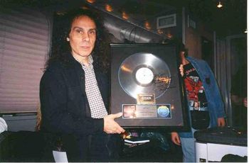 Ronnie was astounded by this gold "Last In Line" that I owned! He signed the front, "To Big Jim-How Do You Do It? Love Ya" on the Dio tour bus in 97.