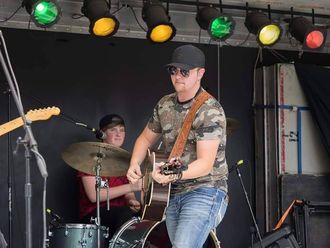 Showing off his amazing guitar skills!