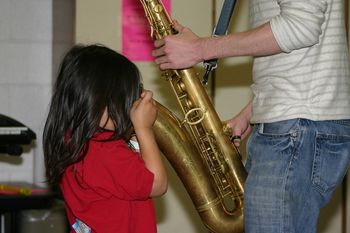 "Where is the music coming from?" Local college students particpate in childrens music camp during the summer.