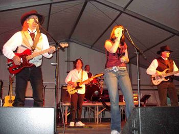 2006 - We've known Brian and Suzy Haner for many years. When we
met them, they had a fantastic band called Suzy and the
Knockouts. Suzy is now one of the most in demand hypnotists
on the circuit. We persuaded them both to jam with us at the
Maricopa Co. Fair. It was great to hear her sing again. You
haven't lost it Suzy!! Brian is still blazing on guitar. You can
hear his guitar work on the new "Avenged Sevenfold" cd