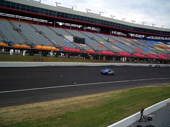 2006- Speaking of legends, Paul Newman was there for all of the
festivities. He's a race car fanatic. Although you can't see him,
that's Paul Newman taking a few laps around the track during
our sound check. From what we hear, he was having so much fun.