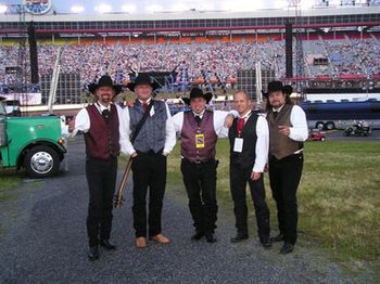 2006 - Cars Release - Despite the rain, an estimated 31,000 people showed up for
this great event! Here's the Doo-Wahs with a few folks in the
background!