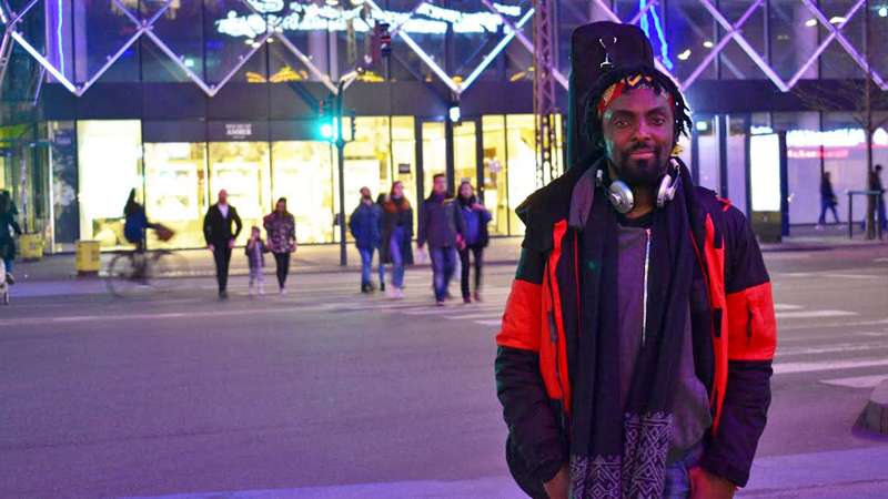 I See Hearts - Ryan Koriya on Vesterbrogade Copenhagen Denmark. With scarf, headphones and guitar