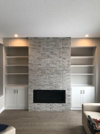 Custom made fire place builts in that we made for a client who just had the home builder provide the stonework and fireplace for a great starting point