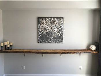 Live edge breakfast nook that a client had us install with brackets that compliment the wood perfectly