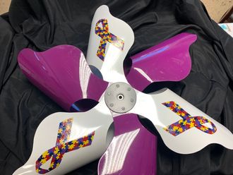 2019 Arts Council of Wilson Pinwheel Project with Bailey's Respite Care Left: Pinwheel Front. Above: Pinwheel Back.