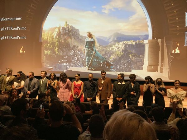 The Cast of The Rings of Power stands up for a round of enthusiastic applause.