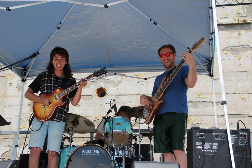 Great Aunt Alice jammin' with bright smiles for the audience at Iron Tails in Acton, Maine.