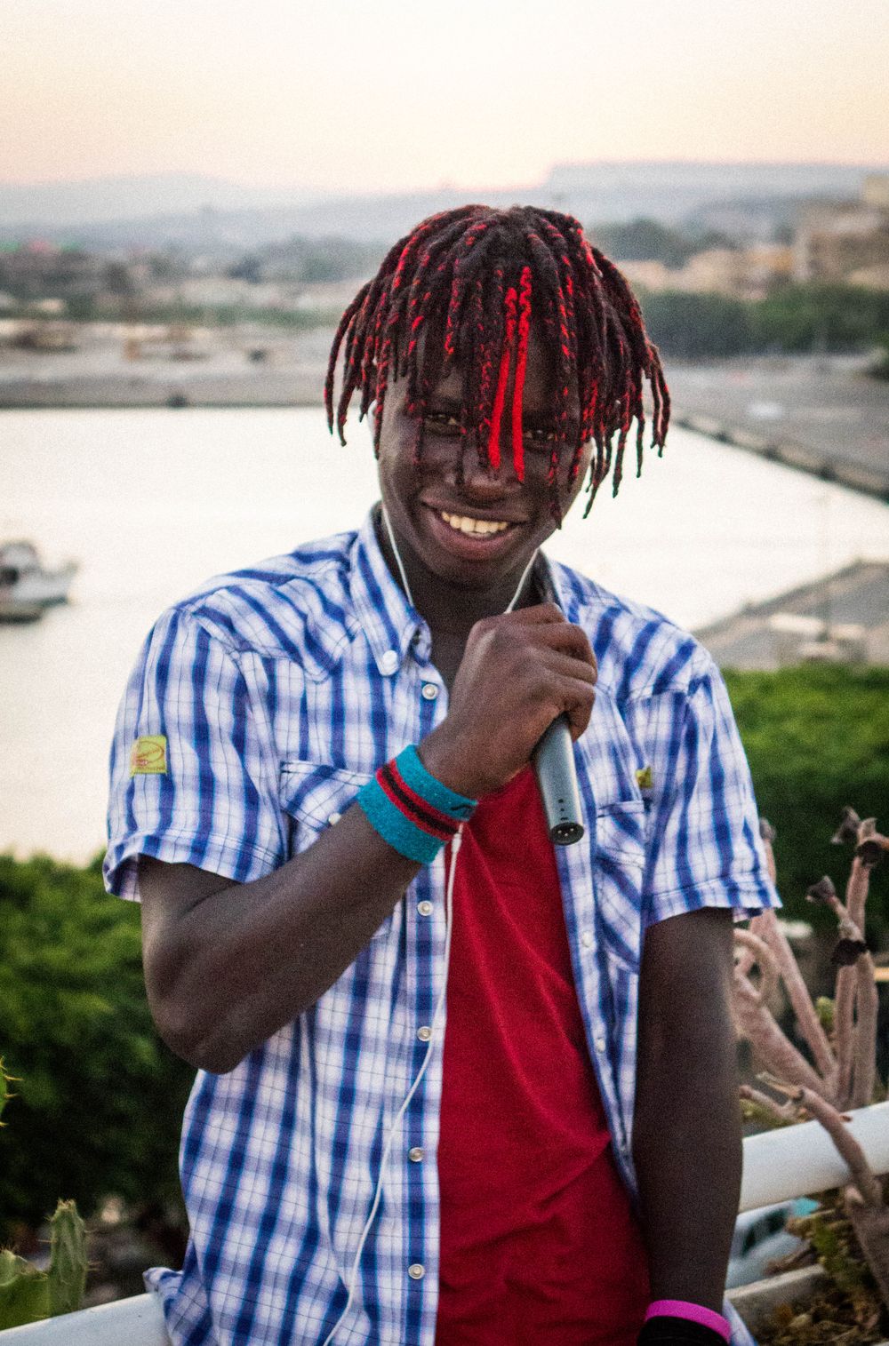 Success’ Verse on “In Libya”: "Before I get to Libya, one week in the desert. Migrant graveyard, no food or water. Many people are dying. Men, women, and children are crying. Every trip in the journey, We are beaten like animals, treated like animals. No food or water, every day, every prison. Beating, killing people every day and every night. Every day we pray to god that we want to be free, From the hands of these people. In Libya."