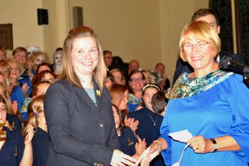 Edwina Kirkland, of Tiffany Village, presents a $10,000 donation to Jennifer Yetman from the Cancer Care Foundation.
