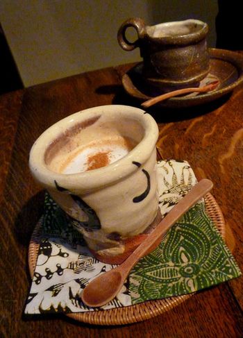 We stop in at a friend’s shop who sells fabrics from Bali. Wonderful artistic people who have espresso made for us that is utterly delicious. We each have two. Yum. My eyes are often satisfied in this esthetic of Japan. On this morning between the cherry blossoms and the colors, textures and patterns of the fabric and the arrangement of the room and garden, I am filled.