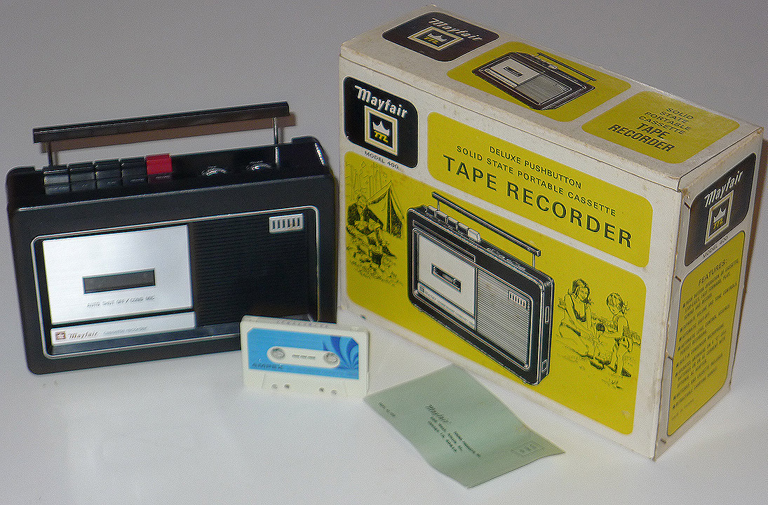 A retro, portable Mayfair tape recorder with a bright yellow box, which features old, 50s-style line illustrations of where it might be used.